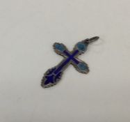 An unusual Russian enamelled silver cross with loo