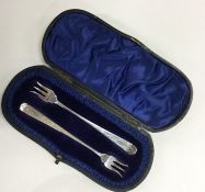 A pair of attractive cased pickle forks with flora