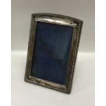 A rectangular silver picture frame with gadroon ri