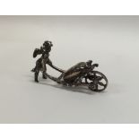 An unusual miniature silver model of a cherub push