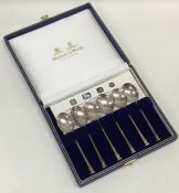 A boxed set of six silver nail top coffee spoons.