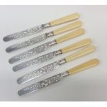 A set of six Edwardian silver engraved tea knives