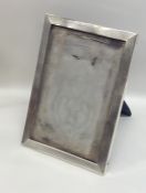 A rectangular engine turned silver picture frame o