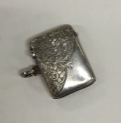 An Edwardian silver engraved vesta case. Birmingha