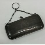 An Edwardian silver engine turned purse with suspe