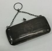 An Edwardian silver engine turned purse with suspe