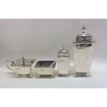 An Art Deco silver four piece cruet of tapering fo