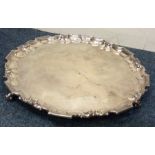 A large heavy silver plain salver with pie crust b