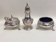 A three piece Edwardian silver cruet set. London.