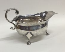 A good Georgian silver sauce boat with card cut ri