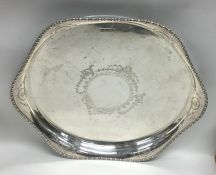 An attractive circular Edwardian silver tea tray w