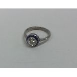 An attractive diamond single stone surrounded by n