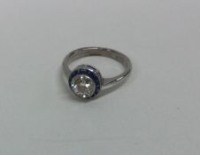 An attractive diamond single stone surrounded by n