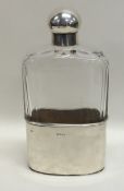 A good glass and silver mounted whisky flask with