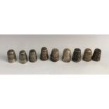 A heavy group of silver and other thimbles. Total