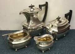 A heavy Georgian style four piece silver tea servi
