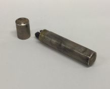 A silver engine turned cylindrical lighter. Approx