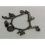 A small silver charm bracelet with heart shaped pa