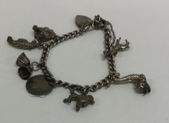 A small silver charm bracelet with heart shaped pa