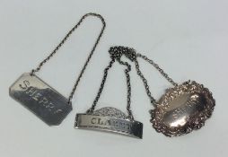 A group of three modern silver wine labels. Approx
