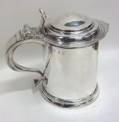 A rare Queen Anne silver hinged top lidded tankard