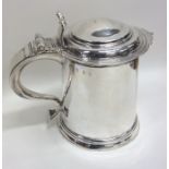 A rare Queen Anne silver hinged top lidded tankard