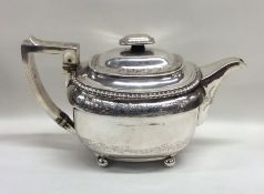 An attractive Georgian silver teapot with gadroon