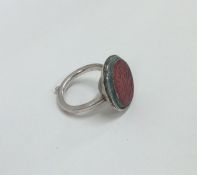 An unusual Islamic silver signet ring mounted with