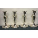 A good set of four silver Adams' style candlestick