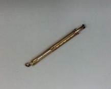 A gold mounted extending quill with loop top. Appr