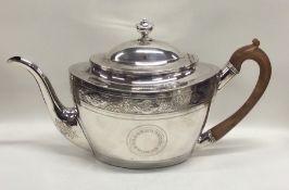 A good Georgian silver oval teapot decorated with