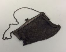 A silver mesh purse on suspension chain. Approx. 1