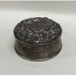 An Edwardian silver embossed top jewellery case. B