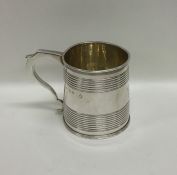 A Georgian silver fluted christening cup with gilt