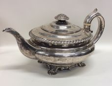 A good quality circular Georgian silver teapot wit