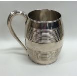 A massive silver barrel shaped mug with reeded dec