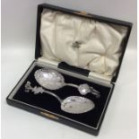 An attractive boxed pair of Dutch silver preserve