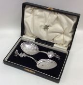 An attractive boxed pair of Dutch silver preserve