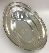A massive oval silver fruit basket decorated with