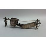 A novelty miniature silver rickshaw. Approx. 48 gr