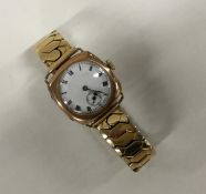 A gent's 9 carat wristwatch with white enamelled d