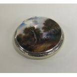 An attractive silver and enamel compact decorated