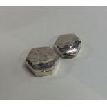 A pair of modern silver hinged top pill boxes engr
