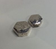 A pair of modern silver hinged top pill boxes engr