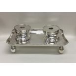 A heavy Britannia Standard silver inkstand on ball