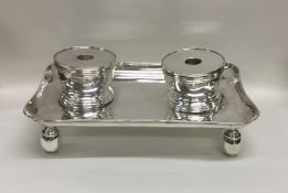 A heavy Britannia Standard silver inkstand on ball