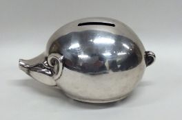 A novelty silver plated money box in the form of a