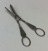 A pair of silver engraved grape scissors decorated