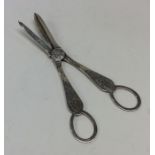 A pair of silver engraved grape scissors decorated