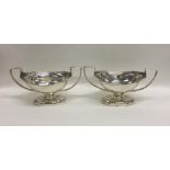 A pair of Georgian silver boat shaped salts reeded